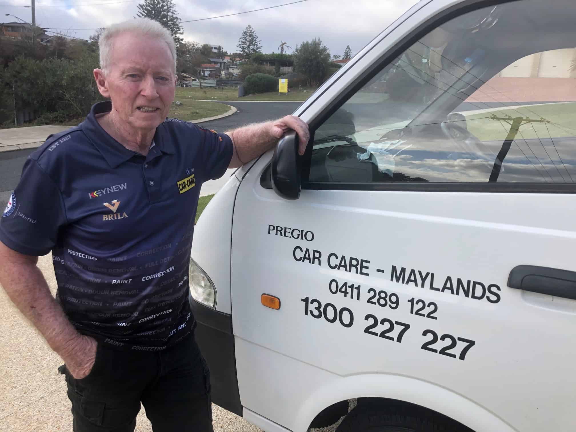 Jim Car Care Maylands leaning on white van